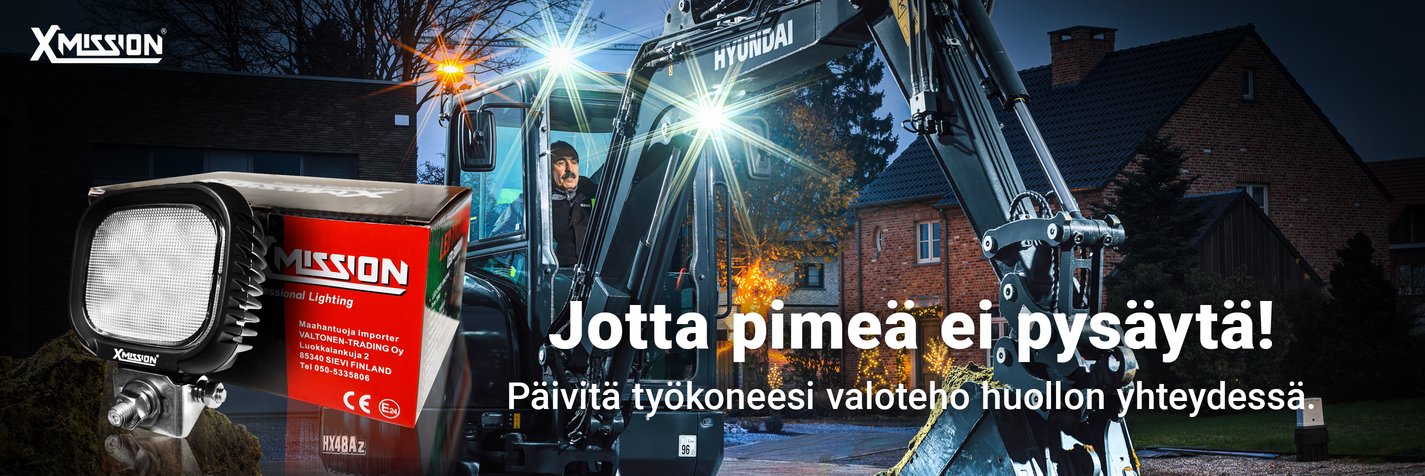 Hyundai kaivinkone työskentelee pimeässä. Vain tehokkaat työvalot valaisevat työmaata.