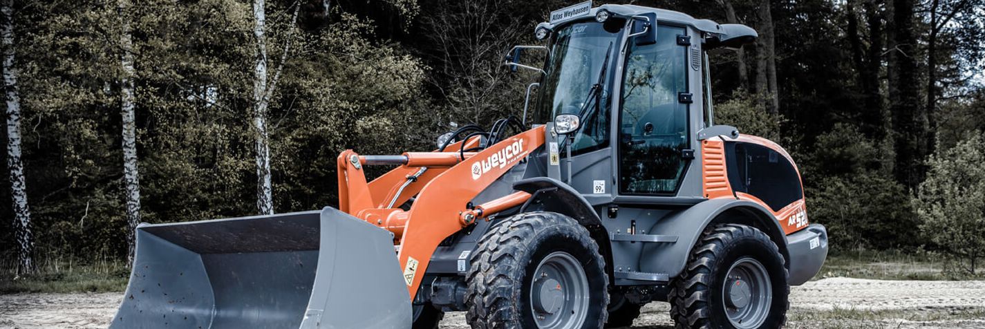 Pyöräkuormaaja Weycor AR520 parkissa työmaalla